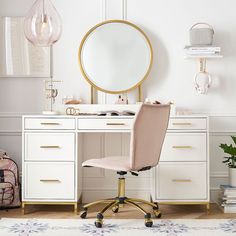 a white desk with a mirror and chair in front of it on top of a rug