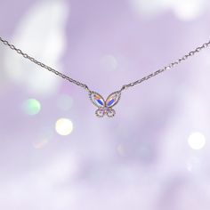 Float like a butterfly, sting like a bee! You'll dazzle everyone when you wear this butterfly necklace. This dainty piece features our best-selling Mari design, but with iridescent stones that catch the light beautifully. 18k gold plated, 18k rose gold plated, or rhodium plated over brass with a protective coating Cubic zirconia stones 16" chain with a 2" extension 1 cm charm width Shop our entire In the Garden Collection here Butterfly Necklace Silver, Sting Like A Bee, Float Like A Butterfly, Like A Butterfly, Necklace Chain Lengths, Butterfly Necklace, Brass Pendant, Wrap Rings, Jewelry Cleaner