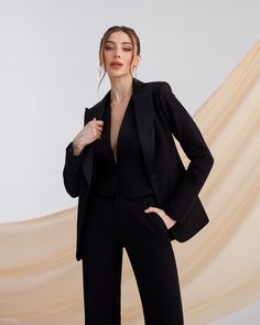 Three-piece pantsuit for women: straight leg pants with high rise, buttoned vest and lined blazer with satin lapel collar Please note suit measurements  Pants length inseam is 35.4 inches or 90 cm Pants length from waist 44 inches or 112 cm Sleeve length 24.4 inches or 62 cm Blazer length along the back 25 1/2 inches or 65 cm Vest length along the back 17.7 inches or 45 cm Our Women's Blazer Trouser Suit for office, business meetings, formal events and special occasions. Always trendy, classic and o good looking DETAILS -  straight leg pants -  high rise -  blazer is buttoned -  lined -  side pockets -  relaxed fit -  single breasted -  buttoned vest MATERIAL Premium quality suiting fabric, consists of viscose, elastane and polyester  SIZES The model in photos is wearing a size S Available Formal Pantsuit, Black Business Casual, Suit Measurements, Business Casual Blazer, Trouser Suit, Suit For Women, Suiting Fabric, Pantsuits For Women, Black Formal