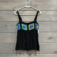 Flowy Black Tank Top With Adjustable Straps. Super Cute Crochet Detail Across Chest. Women’s Size Medium. New With Tags. Black Vest Camisole For Vacation, Fitted Multicolor Camisole For Beach, Stretch Vest For Vacation, Black Stretch Vest For The Beach, Trendy Tank Vest For Beach, Summer Cami Vest For Beach, Summer Cami Vest For The Beach, Trendy Sleeveless Crochet Top For Beach Season, Sleeveless Trendy Crochet Top For Beach Season