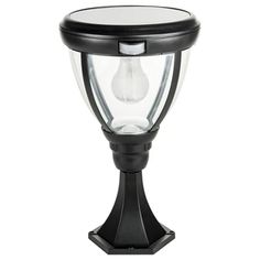 a black post light with a clear glass top on an isolated white background for use in outdoor lighting