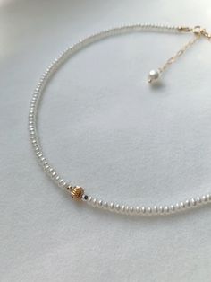 This beautiful choker was created with real, natural, freshwater pearls. The beads and spring rings are all made with 14K gold filled which is sensitive skin-friendly and guarantee long lasting wear. All of the freshwater pearls we picked are AAA luster. For any occasion being weddings, birthdays or graduation pictures this necklace has pearls that are approximately 3.5-4mm. This will be just the right addition to your look! The necklace is presented with spring ring, and a 2 inch extension that Minimalist Handmade Pearl Necklace, Minimalist Pearl White Jewelry With Tiny Beads, Minimalist Pearl Jewelry With Tiny Beads, Delicate Pearl Jewelry With Tiny Beads, Dainty Pearl Necklace With Round Beads, Minimalist Pearl Necklace With Tiny Beads, Minimalist Pearl White Necklace With Tiny Beads, Everyday Minimalist Pearl Necklace With Tiny Beads, Handmade Dainty Pearl Choker Necklace