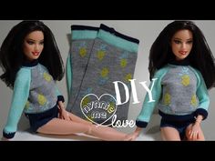 the doll is wearing a sweater and shorts