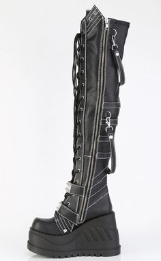 The stompiest boots around! These chonky wedges are a gift from the platform gods, slip in and stomp around babey!!! Vegan Black stretch PU leather 4 3/4 (121mm) inch platform Lace-up Featuring Two Hook-N-Loop Straps W/ Spike Studded Metal Plate White Contrast Stitching & Removable Hanging Strap Details, Full length inside zip closure U.S. women's sizing-refer to size chart for more info. Leather Knee-high Platform Boots For Streetwear, Edgy Black Knee-high Platform Boots, Alternative Black Knee-high Platform Boots, Punk Leather Knee-high Boots For Concert, Punk Leather Knee-high Boots For Streetwear, Punk Style Chunky Platform Heeled Boots In Faux Leather, Gothic Leather Heeled Boots With Chunky Platform, Punk Style Faux Leather Heeled Boots With Chunky Platform, Knee-high Faux Leather Punk Platform Boots