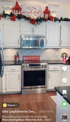 the kitchen is decorated for christmas with red and green decorations on the wall above the stove