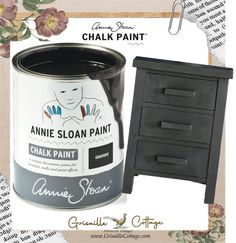 a black painted cabinet next to a white paint can with the words annie sloan paint on it