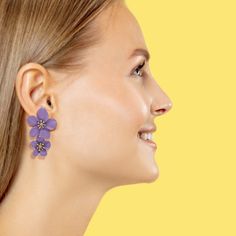 Introducing our exquisitely crafted Lavender Floral Enamel Earrings, a delightful pair designed for the floral enthusiast in you. These earrings are a perfect blend of elegance and whimsy, with intricate floral details and golden pistils that add a touch of sophistication to any ensemble. Crafted with meticulous attention to detail, these earrings showcase the beauty of lavender flowers in full bloom, capturing their delicate charm and grace. The enamel work brings the flowers to life, adding a Purple Flower Shaped Jewelry With Flower Decoration, Purple Flower Shaped Jewelry For Spring, Lavender Flower Jewelry For Pierced Ears, Purple Wedding Jewelry With Flower Decoration, Purple Flower Jewelry For Spring, Elegant Purple Jewelry With 3d Flowers, Purple Flower-shaped Earrings For Spring, Elegant Purple Flower Earrings, Elegant Purple Flower Shaped Earrings