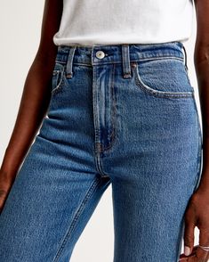 On-trend 90's-style high rise relaxed jeans, that are slim at the top with a wider leg shape, featuring a full-length leg, medium wash and raw-cut hem. High Rise Rigid Denim Flare Jeans For Everyday, Classic High Waist Flare Jeans For Everyday, Fitted Summer Flare Jeans, Classic High Waist Mom Jeans, Classic High Waist Flare Jeans, High Rise Flare Jeans For Everyday Summer Wear, Straight Fit Jeans For Everyday Summer Wear, High Waist Cropped Jeans For Everyday, Spring Mom Fit Flare Jeans