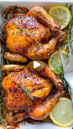 roasted chicken with lemons and herbs in a baking dish