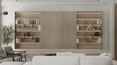 a living room filled with furniture and bookshelves next to a wall mounted book shelf