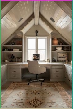 an attic home office with built - in desk and drawers