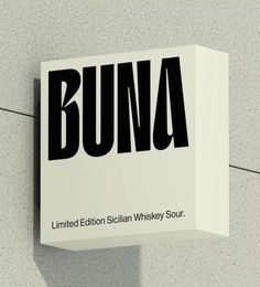 a sign on the side of a building that says buna, limited edition sicilian whisky sour