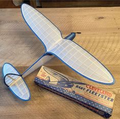 a toy airplane sitting on top of a wooden table