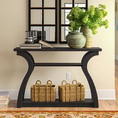 a shelf with baskets and plants on it in front of a mirror, next to a bookcase