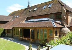 an image of a house with solar panels on the roof