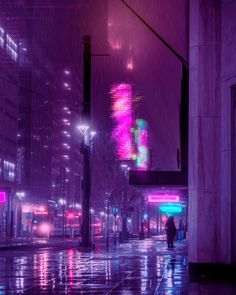 a city street at night in the rain