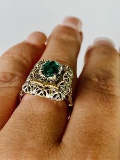 Beautiful vintage 18K yellow and white gold emerald ring. The openwork filigree work white gold setting has a lovely gold detail surrounding a pronged marquise cut emerald (approx. 9.9mm x 5.7mm). The ring measures approx. 19.2mm from north to south and 13mm from east to west. The ring is currently sized at 6.5 and marked 18k. 5.3 grams total weight. White Gold Emerald Ring, Gold Emerald Ring, Emerald Ring Gold, Aquamarine Bracelet, White Gold Set, Gold Filigree, 3 Carat, Marquise Cut, Emerald Ring