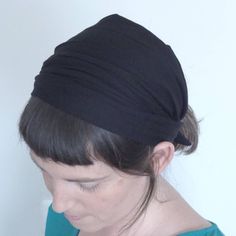 A wide headband  for women made of soft fabric. Super comfy on your head. The headband is a TIE ON headband, it is light weight and soft. A great gift for women, unique and in a limited edition. Comes nicely wrapped. The black fabric has tiny holes, visible on a light surface, creating a bit of an extra chic touch.  Why TIE ON headband? I make all of my headbands TIE ON since I find this the most comfy way to wear them, the stay on perfectly and don't feel tight on the head like often feels with elastic.   Colors Choose upon check up. Looking for a color that is not in the list? Right me I will gladly make it for you   size Headband width is approx. 30 cm 13 inch  Custom orders I do make custom orders. Please contact me for a specific color combo made just for you!  Shipping  The headband Stretch Headwrap With Matching Headband, Cotton Sweatband Headwrap, Solid Color Headscarf Shaped As Headband, Black Headscarf In Headband Shape, Black Headscarf With Matching Headband, One Size Fits Most Headband Headscarf, Kerchief Headband, Lace Headwrap, Christian Head Covering