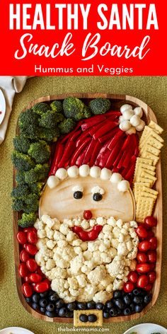 healthy santa snack board with hummus and veggies on the side for kids to eat