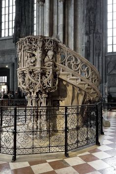 an intricately designed staircase in the middle of a building