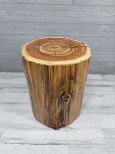 a wooden stool made out of tree trunks