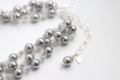 Our Silver Elegance necklace is a stunning accessory that pays tribute to classic elegance with its graceful, cascading strands of pearls, rhinestones and crystals. Featuring gorgeous Swarovski© glass pearls in different hues, a sparkling rhinestone ball and Swarovski© Crystals. Silver chain is adjustable ready to fit any outfit. Make it your own, and wear it in any way that suits you. Silver Strand, Murano Glass Beads, Swarovski Pearls, Classic Elegance, Artisan Jewelry, Semiprecious Stones, Precious Stones, Freshwater Pearls, Silver Chain