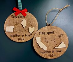 two personalized wooden christmas ornament with state names and location on each one