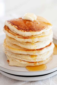 a stack of pancakes with butter on top