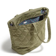 This large travel tote has lots of pockets inside and out to keep everything neatly organized. The zip closures keep everything secure. Details: Features two compartments. Interior features three mesh slip pockets and a zip pocket. Zip closures. Capacity 29 L. Care Tips: Spot clean with mild detergent and a soft, damp cloth, rinse thoroughly; line dry Green Luggage With Zipper Closure For Daily Use, Casual Bags For Overnight Trips, Khaki Nylon Shoulder Bag For Travel, Nylon Khaki Shoulder Bag For Travel, Green Travel Bag With Zipper Closure, Green Weekender Bag With Zipper For Travel, Green Weekender Bag With Zipper Closure For Travel, Green Travel Bag With Zipper For Overnight Trips, Everyday Travel Tote With Zipper Closure