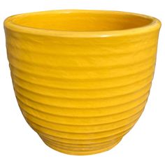 a yellow bowl is shown on a white background