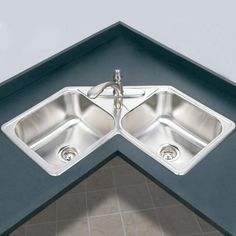 an image of two sinks in the corner