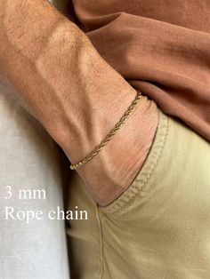 Elevate your style with our men's gold-tone stainless steel chain bracelet. Crafted from durable stainless steel, this bracelet is resistant to corrosion and tarnish, ensuring long-lasting shine and reliability. Features: - Material: Stainless Steel - Color: Gold-Tone - Sizes: Available in various lengths for a perfect fit You can see our other bracelet designs here https://www.etsy.com/shop/TheUrbanMonarch?ref=l2-about-shopname&from_page=listing§ion_id=49985390 This bracelet is perfect for both everyday wear and special occasions, easily pairing with other accessories and jewelry. The secure clasp ensures comfort and safety. Add a touch of elegance and modern flair to your wardrobe with this versatile chain bracelet! How to Choose the Right Size for a Chain Bracelet Measure Your Wrist: Wr Mens Chain Bracelet, Mens Gold, Chains For Men, Stainless Steel Jewelry, Stainless Steel Chain, Chain Link Bracelet, Bracelet Designs, Snug Fit, Chain Bracelet