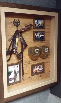 a wooden frame with horse related items in it