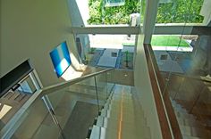 Ultra modern home remodel stairway view of glass wall atrium entryway. Ultra Modern Homes