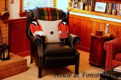 a living room filled with furniture and a fire place next to a book shelf full of books