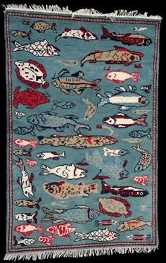 an old rug with fish on it