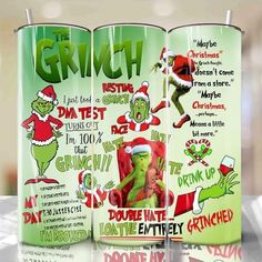 the grinch christmas movie poster is on display in front of two green cans with santa's hats