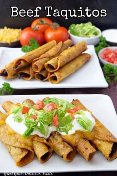 two white plates topped with taquitass covered in lettuce and tomatoes