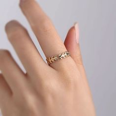 "Indulge in the timeless elegance of our 14K gold rings, meticulously crafted to enhance your personal style. Each ring is expertly made from genuine 14K gold, radiating a warm and luxurious glow that will captivate all who lay eyes on it. Our collection boasts an array of stunning designs, ranging from sleek and minimalist to intricate and ornate, ensuring there's a perfect ring to match your unique taste. Whether you're looking for a statement piece to dazzle at special occasions or a delicate band for everyday elegance, we have something to suit every occasion. Crafted with exceptional attention to detail, our 14K gold rings showcase exquisite craftsmanship that stands the test of time. The high-quality gold ensures lasting durability, allowing you to cherish your ring for years to come Floral Wedding Band, Floral Wedding Bands, Wedding Band Women, Branch Ring, Real Gold Jewelry, Leaf Ring, 14k Gold Ring, Ring Gold, Perfect Ring