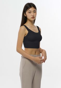 Soft and fitted crop top with scoop neckline.