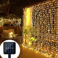 a patio covered in fairy lights and decorated with potted plants on the outside deck