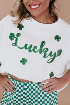 Introducing the Lucky Sequin Patch Top in White, a stunning addition to your St. Patrick's Day wardrobe! This eye-catching top features a white fabric adorned with a shimmering sequin patch in the shape of a lucky charm. The sequin patch adds a touch of sparkle and whimsy to your outfit, making it perfect for celebrating the holiday in style. Sequin patched top Lucky sequin patch Oversized top White + Green sequin detailing throughout Dolman sleeve 100% Cotton Imported Model Specs: Emily is wearing a size small in the photo.How will this item fit you? Check out our MODEL SPECS (Typical Sizing - Karli: S-Size 5/26 - 5ft 2in, Emily: S-Size 3/25 - 5ft 5in, Syd: L/XL- Size 15/ - 5ft 8in)﻿Need help with sizing? No problem! Join our VIP group on Facebook, Everyday Chic Boutique VIP Insiders to c Patch Top, Sequin Patch, Peach Love, Vip Group, Everyday Chic, Green Sequins, Outfit Making, White Men, Everyday Activities