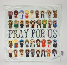 a cross stitched wall hanging with the words pray for us surrounded by images of people