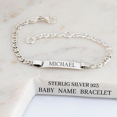 ♥ This 925 sterling silver baby name bracelet is the perfect customized gift for a new baby. The laser-engraved bar bracelet is designed specifically for kids, with a personalized option of back engraving. This kid's bracelet is handmade with high-quality sterling silver and features a unique silver chain. The endless customization options allow you to choose the perfect name and hidden message to make this bracelet a special gift for a baby girl. ♥ S I Z E  &  M A T E R I A LS: ★ STYLE: Kids Na Classic Silver Name Bracelet For Birthday, Classic Personalized Birthday Bracelets, Personalized Sterling Silver Name Bracelet, Classic Adjustable Name Bracelet For Birthday, Personalized Name Bracelet In Sterling Silver, Personalized Name Bracelets In Sterling Silver, Silver Name Bracelet For Everyday, Silver Nameplate Bracelet For Anniversary, Personalized Name Sterling Silver Bracelet