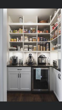 a kitchen with white cabinets and black counter tops is shown in this instagramtion