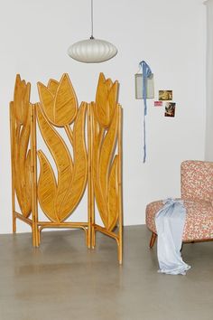 a chair and table in a room with white walls