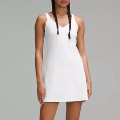 New With Tags Lululemon Align Dress White Get The Buttery Softness Of Lululemon Align In A Dress. Powered By Nulu Fabric And Made With A Built-In Shorts Liner, Your Poses And Postures Have Never Felt This Free. Designed For Yoga And Casual Feels Buttery-Soft And Weightless, Nulu Fabric So Buttery Soft, It Feels Weightless Four-Way Stretch Sweat-Wicking Breathable Added Lycra Fibre For Stretch And Shape Retention Medium Support Sizes 0-14 Fit B/C Cups Tight Fit Contours Your Body Intended To Sit Spring V-neck Athleisure Dresses, Align Dress, Lululemon Align, Dress White, Lululemon Athletica, New Dress, Built In, White Dress, Size 10