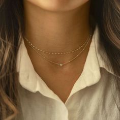 This elegant choker from our signature O Collection is great to pair with other necklaces from this collection. Our patented connectors let you easily link and layer necklaces in any order you desire. Learn more Chain Thickness 1.5mm Cubic Zirconia Diameter: 0.2in (5mm) Adjustable chain: 15-18in (38-45cm) .925 Sterling Silver Spring clasp closure Hypoallergenic, lead and nickel free #040S Cheap Silver Layered Choker Necklace, Silver Necklaces Simple Minimalist, Simple Choker Necklaces, Cheap White Layered Necklaces, Luxury Minimalist Necklaces For Layering, Dainty Adjustable Layered Necklace, Affordable White Elegant Layered Necklace, Cheap Elegant Choker With Delicate Chain, Minimalist Jewelry Silver Layered