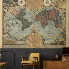 an old world map hanging on the wall