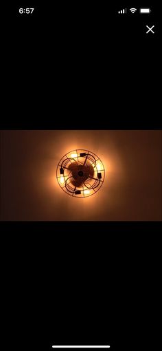 an overhead view of a ceiling light in the dark with dim lighting and no bulbs